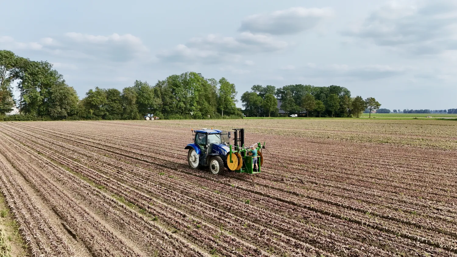 Wynajem zwijarki do węży kroplujących - Noordoostpolder