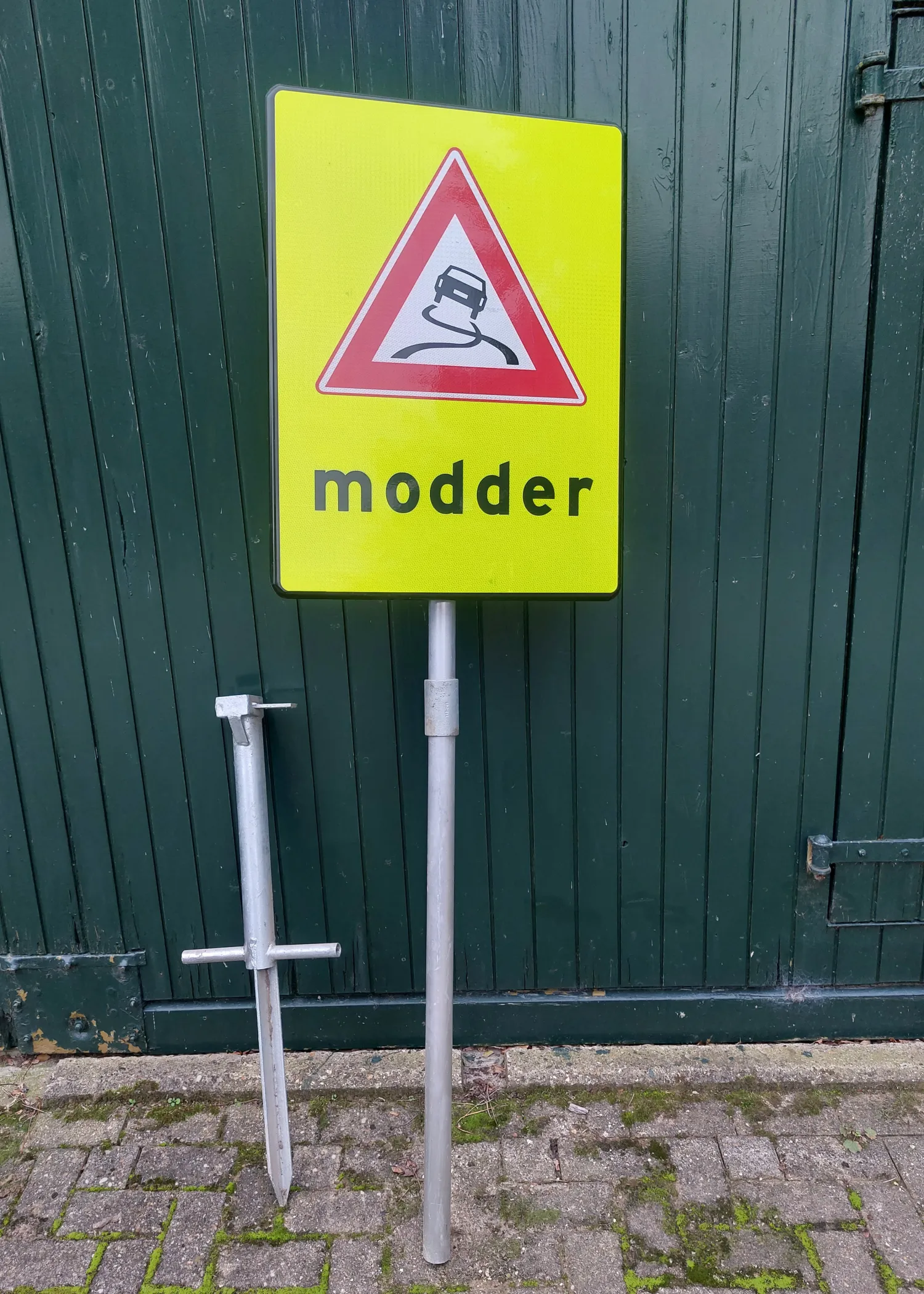 Pas op modder! - Waarschuwingsbord voor gladde wegen